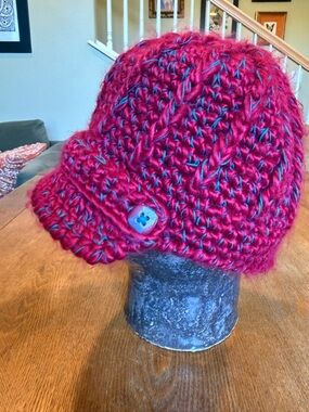 pistil Red Knit Brimmed Beanie with front strap. Cute page boy style.